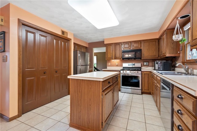 2507 Sarah Ct, Murrysville, PA 15668 - kitchen with stainless steel appliances, brown cabinets, light countertops, a kitchen island, and light tile patterned floors