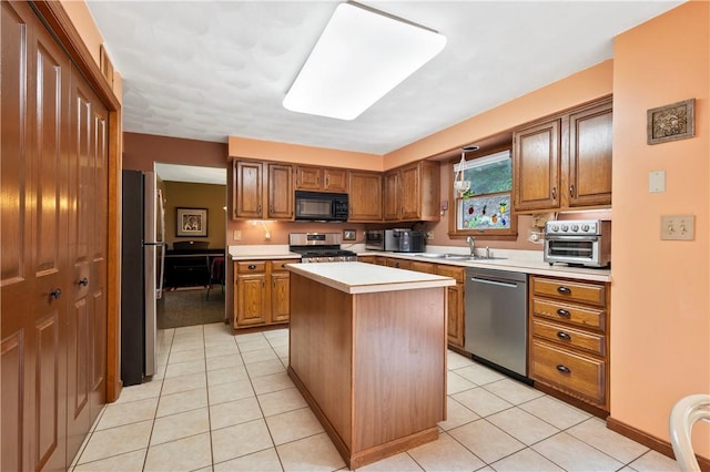 2507 Sarah Ct, Murrysville, PA 15668 - kitchen featuring appliances with stainless steel finishes, light countertops, light tile patterned floors, a kitchen island, and brown cabinets