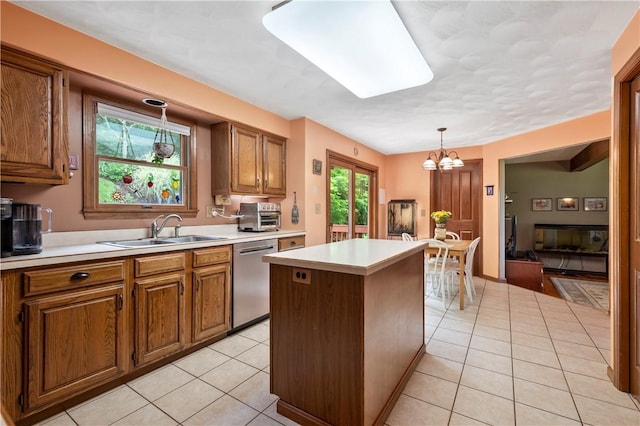 2507 Sarah Ct, Murrysville, PA 15668 - kitchen featuring stainless steel dishwasher, a center island, a chandelier, light tile patterned flooring, and brown cabinets