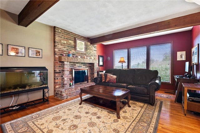 2507 Sarah Ct, Murrysville, PA 15668 - living room featuring beam ceiling, wood finished floors, and a brick fireplace