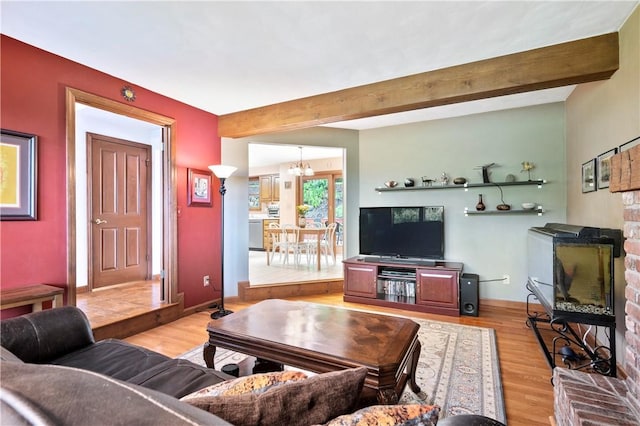 2507 Sarah Ct, Murrysville, PA 15668 - living room with light wood-type flooring, beam ceiling, a chandelier, and a brick fireplace