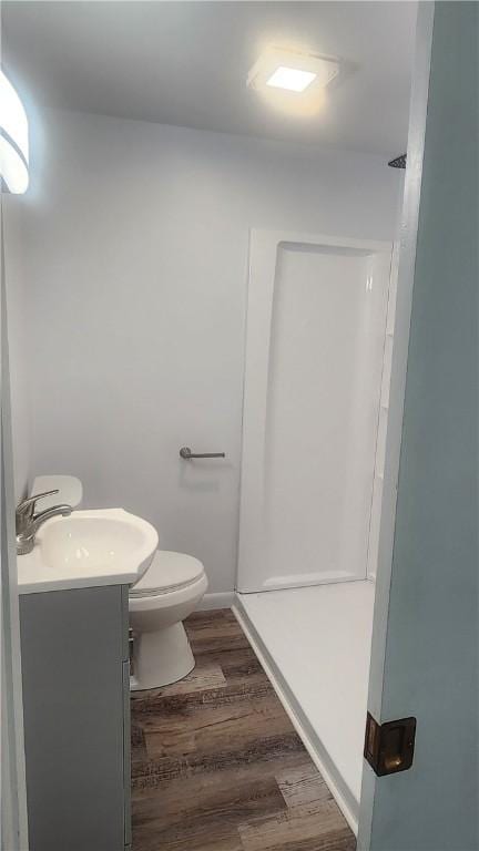 118 Brady Ave, City Of Washington, PA 15301 - bathroom featuring vanity, a stall shower, and wood finished floors