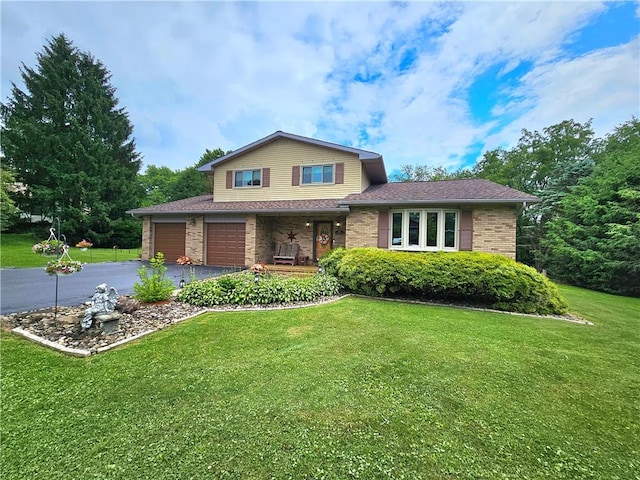 15 Pineview Ests, Sewickley Twp, PA 15089 - view of front of home with driveway, brick siding, a front yard, and a porch