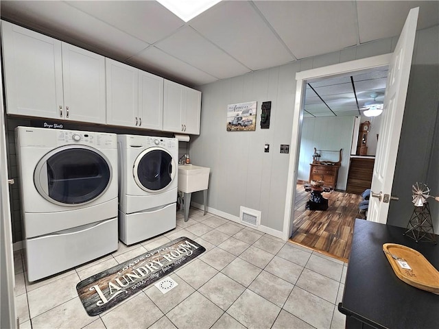 15 Pineview Ests, Sewickley Twp, PA 15089 - laundry area with washing machine and dryer, cabinet space, and light tile patterned floors