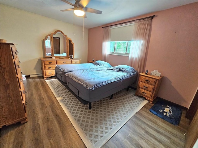 15 Pineview Ests, Sewickley Twp, PA 15089 - bedroom with wood finished floors, baseboard heating, and a ceiling fan