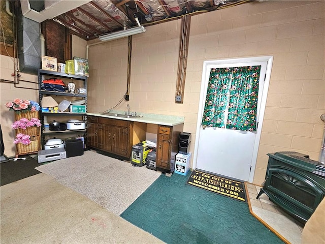 15 Pineview Ests, Sewickley Twp, PA 15089 - basement with a wood stove and concrete block wall