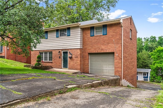 765 Brafferton Dr, Mt Lebanon, PA 15228 - view of front of house with a garage, driveway, and brick siding