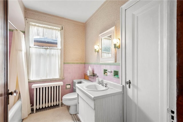 1223 Ingham St, Marshall Shadeland, PA 15212 - bathroom with radiator, a wainscoted wall, vanity, wallpapered walls, and tile walls