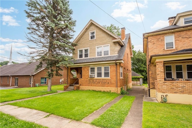 1223 Ingham St, Marshall Shadeland, PA 15212 - view of front facade featuring brick siding, a chimney, a front lawn, and cooling unit