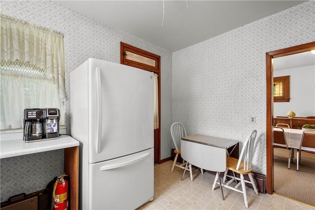 1223 Ingham St, Marshall Shadeland, PA 15212 - kitchen with freestanding refrigerator, wallpapered walls, and light countertops