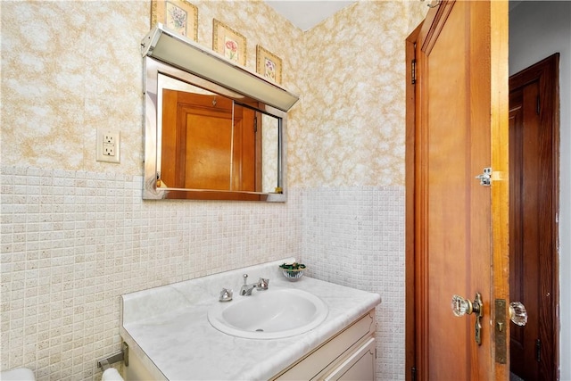 1223 Ingham St, Marshall Shadeland, PA 15212 - bathroom featuring vanity, tile walls, and wallpapered walls