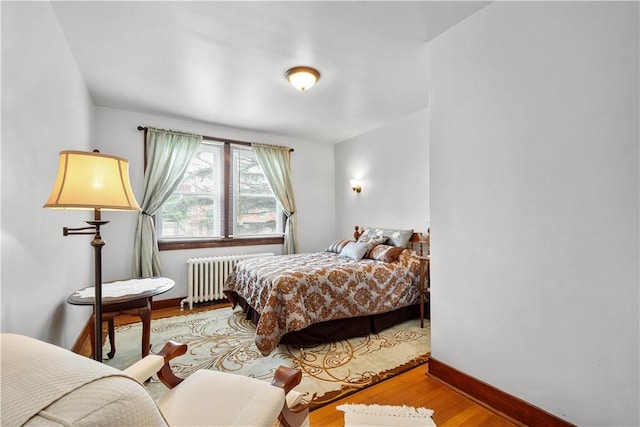 1223 Ingham St, Marshall Shadeland, PA 15212 - bedroom featuring radiator heating unit and wood finished floors