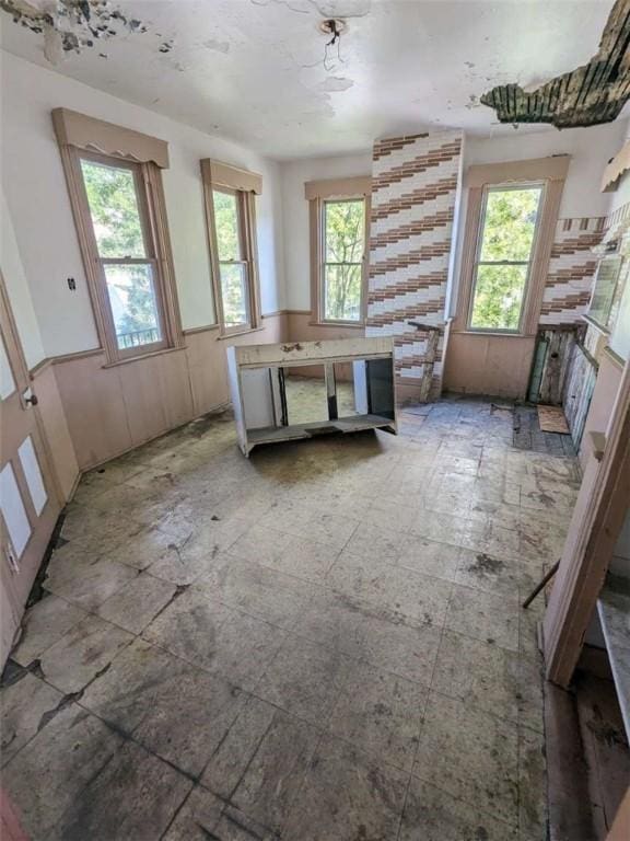 1261 High St, Spring Hill, PA 15212 - unfurnished dining area featuring wainscoting and plenty of natural light