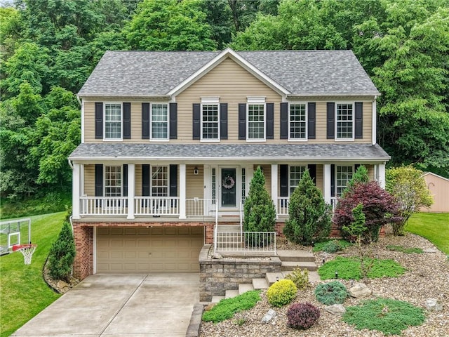 54 Colony Oaks Dr, Shaler, PA 15209 - view of front of home featuring covered porch, driveway, an attached garage, and a front lawn
