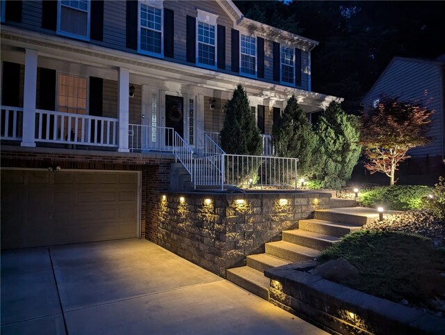 54 Colony Oaks Dr, Shaler, PA 15209 - view of front of house featuring stairway, a porch, concrete driveway, and an attached garage