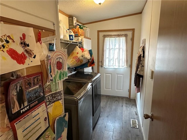 170 Hungarian Rd, Cherry Twp, PA 16057 - laundry room with washing machine and dryer, wood-type flooring, ornamental molding, and a textured ceiling