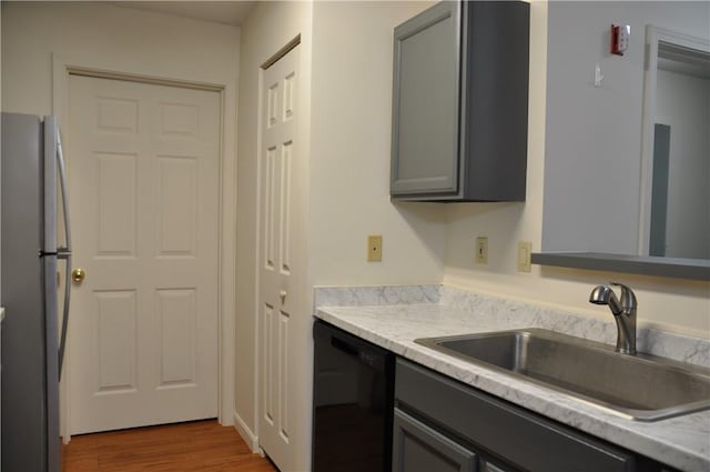 1101 Lenox Dr, Bethel Park, PA 15102 - kitchen featuring dishwasher, freestanding refrigerator, light countertops, and wood finished floors