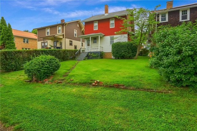 83 Evans Ave, Ingram, PA 15205 - back of property featuring a yard and a chimney