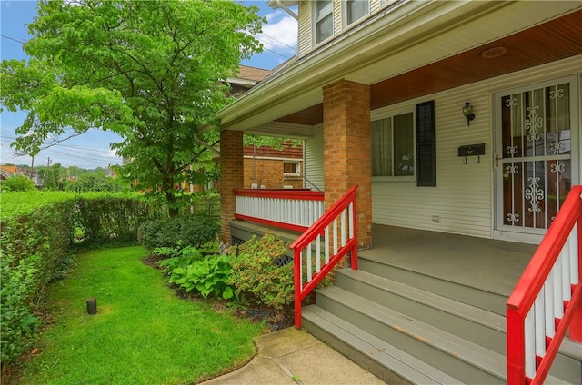 83 Evans Ave, Ingram, PA 15205 - view of exterior entry with covered porch and a yard