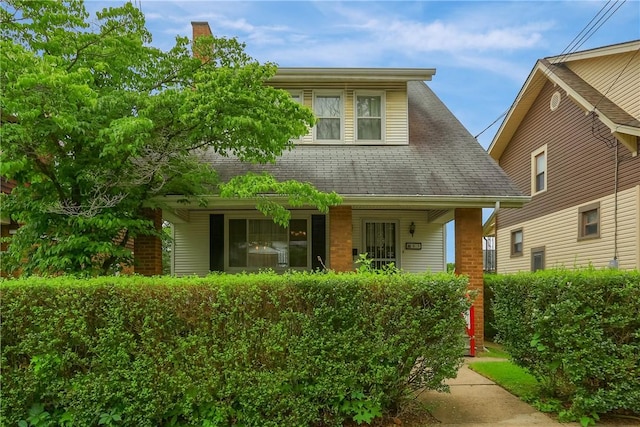 83 Evans Ave, Ingram, PA 15205 - view of front facade featuring covered porch, a chimney, and roof with shingles