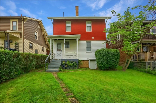 83 Evans Ave, Ingram, PA 15205 - rear view of house with a yard, a porch, and a chimney