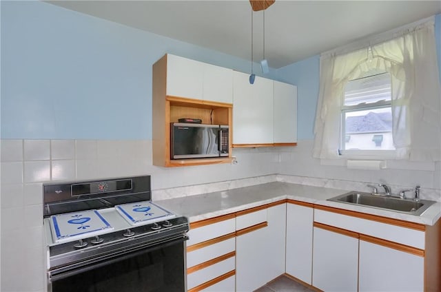 83 Evans Ave, Ingram, PA 15205 - kitchen featuring black appliances, white cabinetry, light countertops, and backsplash