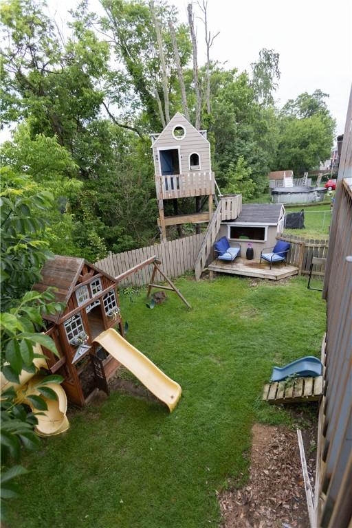 1632 Norwalk St, Crafton Heights, PA 15205 - fenced backyard with a playground, a wooden deck, and a storage unit