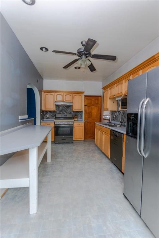 1632 Norwalk St, Crafton Heights, PA 15205 - kitchen with stainless steel appliances, under cabinet range hood, tasteful backsplash, a ceiling fan, and arched walkways