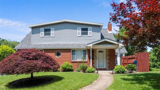 6623 Saltsburg Rd, Penn Hills, PA 15235 - view of front facade with a chimney, brick siding, and a shingled roof