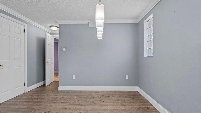 6623 Saltsburg Rd, Penn Hills, PA 15235 - empty room with wood finished floors, a textured ceiling, and ornamental molding