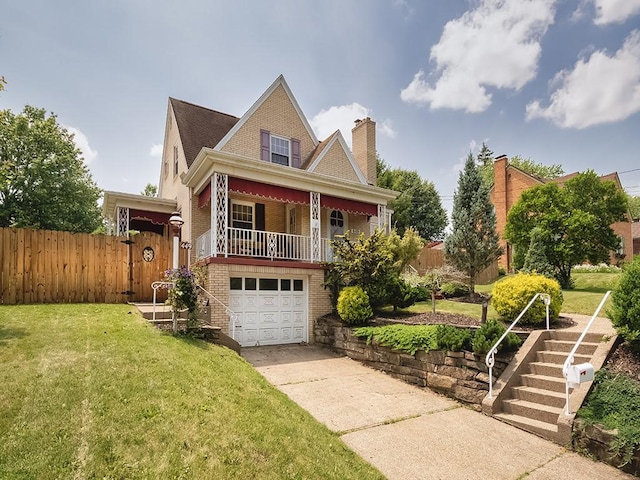 449 Woodland Rd, Canonsburg, PA 15317 - victorian house with brick siding, concrete driveway, a garage, covered porch, and a chimney