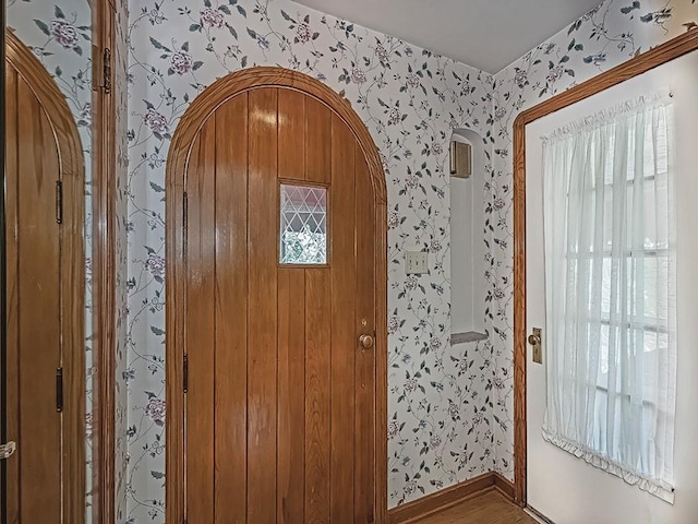 449 Woodland Rd, Canonsburg, PA 15317 - entryway featuring wallpapered walls, arched walkways, and wood finished floors