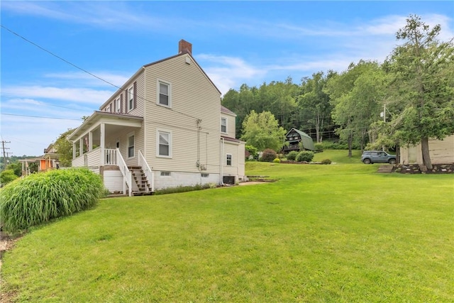 104 Highland Ave, Avella, PA 15312 - view of home's exterior with a chimney, a lawn, and stairway