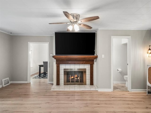 537 Ambridge Ave, Leet Twp, PA 15003 - unfurnished living room with wood finished floors, ornamental molding, a ceiling fan, and a fireplace