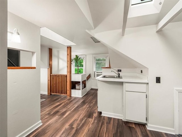 537 Ambridge Ave, Leet Twp, PA 15003 - kitchen featuring dark wood-style flooring, light countertops, white cabinetry, a peninsula, and lofted ceiling