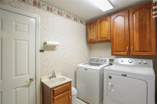 143 Hampshire Dr, Cranberry Twp, PA 16066 - laundry room with washer and clothes dryer, cabinet space, and wallpapered walls