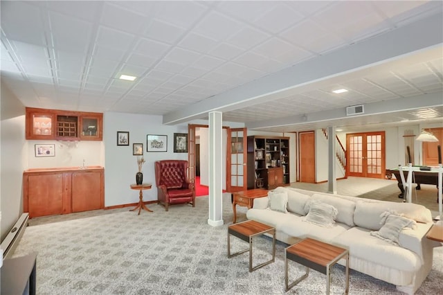 143 Hampshire Dr, Cranberry Twp, PA 16066 - living area with light carpet, wet bar, and a baseboard heating unit