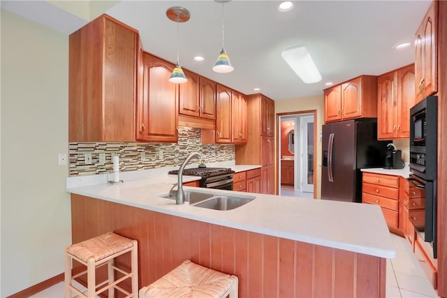143 Hampshire Dr, Cranberry Twp, PA 16066 - kitchen with a peninsula, black oven, backsplash, refrigerator with ice dispenser, and light countertops