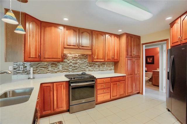 143 Hampshire Dr, Cranberry Twp, PA 16066 - kitchen with refrigerator with ice dispenser, stainless steel range with gas stovetop, decorative backsplash, light countertops, and hanging light fixtures
