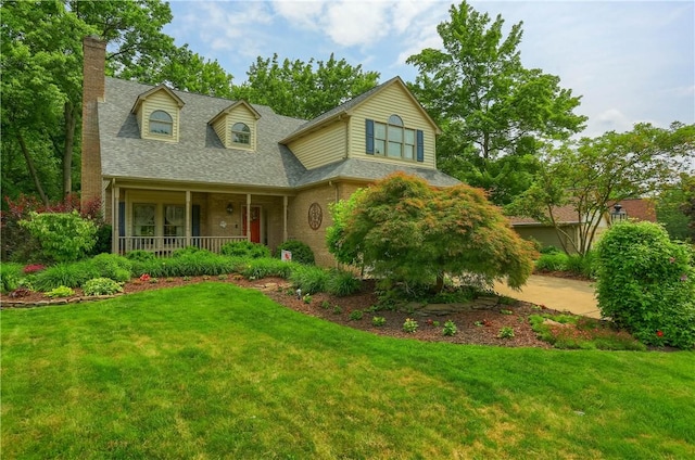 143 Hampshire Dr, Cranberry Twp, PA 16066 - view of front of home with a chimney, covered porch, a front lawn, and roof with shingles
