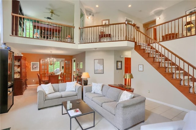 143 Hampshire Dr, Cranberry Twp, PA 16066 - living room with stairway, a chandelier, a towering ceiling, a ceiling fan, and recessed lighting