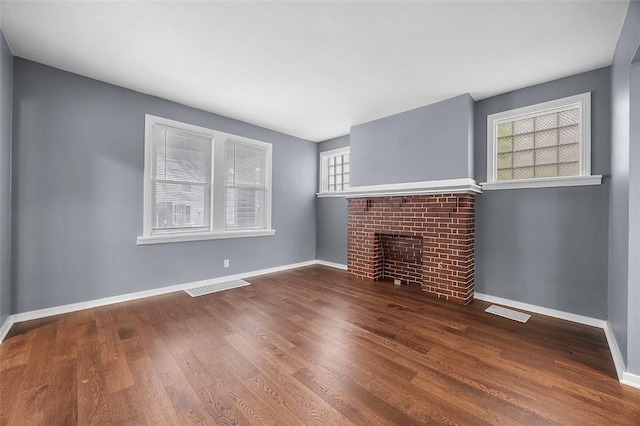 1014 Fordham Ave, Brookline, PA 15226 - unfurnished living room featuring wood finished floors and a fireplace