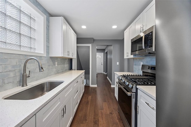 1014 Fordham Ave, Brookline, PA 15226 - kitchen featuring appliances with stainless steel finishes, backsplash, recessed lighting, white cabinets, and dark wood finished floors