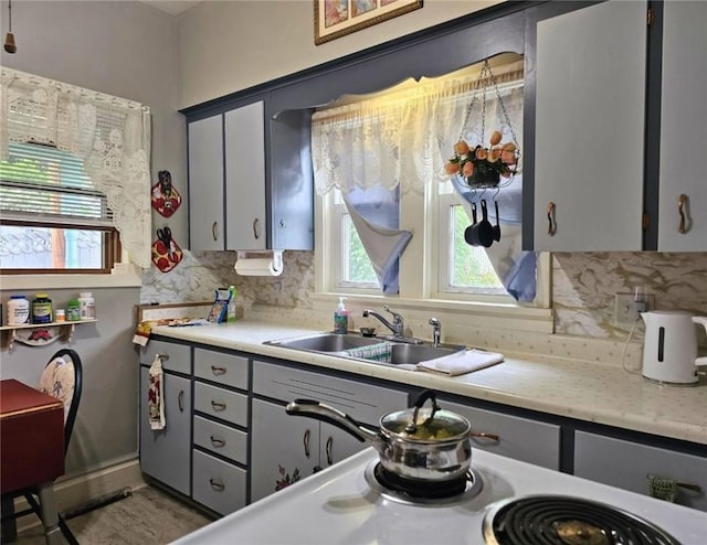 12311/2 Otter St, City Of Franklin, PA 16323 - kitchen with gray cabinets, decorative backsplash, and light countertops