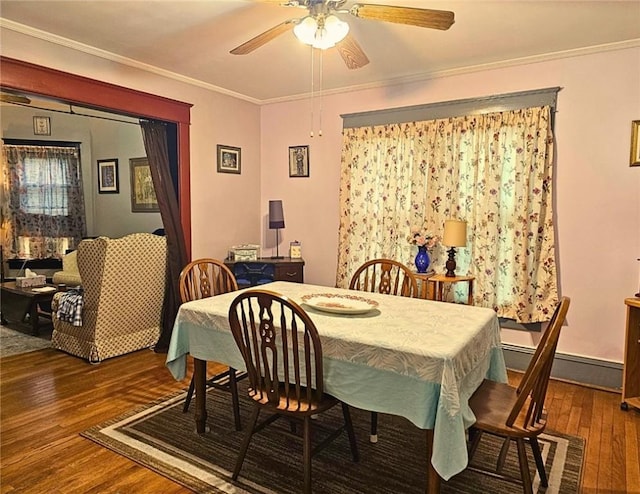 12311/2 Otter St, City Of Franklin, PA 16323 - dining space with wood-type flooring, ceiling fan, a baseboard radiator, and crown molding