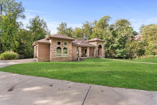 912 Field Club Rd, Ohara, PA 15238 - view of front facade featuring stone siding, a front lawn, and concrete driveway