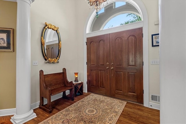 912 Field Club Rd, Ohara, PA 15238 - entryway featuring decorative columns, wood finished floors, and a chandelier