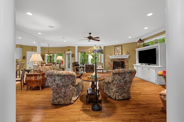 912 Field Club Rd, Ohara, PA 15238 - living area with plenty of natural light, light wood-type flooring, a ceiling fan, a fireplace with raised hearth, and recessed lighting