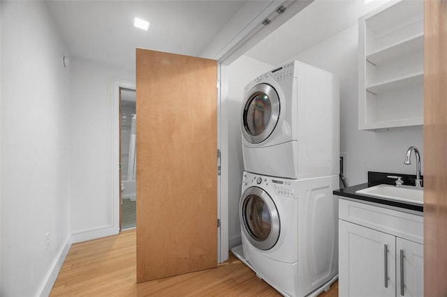 1821 Merriman, South Side, PA 15203 - laundry area featuring estacked washer and dryer and light wood-type flooring
