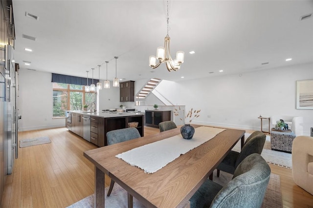 1821 Merriman, South Side, PA 15203 - dining room featuring stairs, light wood-style flooring, a chandelier, and recessed lighting